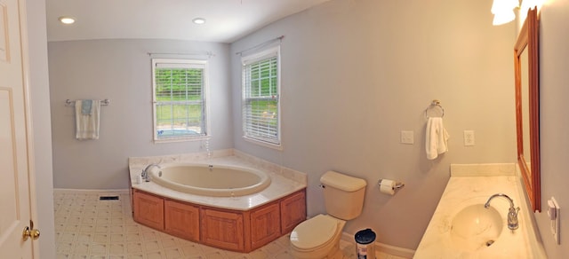 547 Grindstone Hollow Rd, Dickson, TN 37055 - bathroom featuring a garden tub, vanity, toilet, baseboards, and recessed lighting