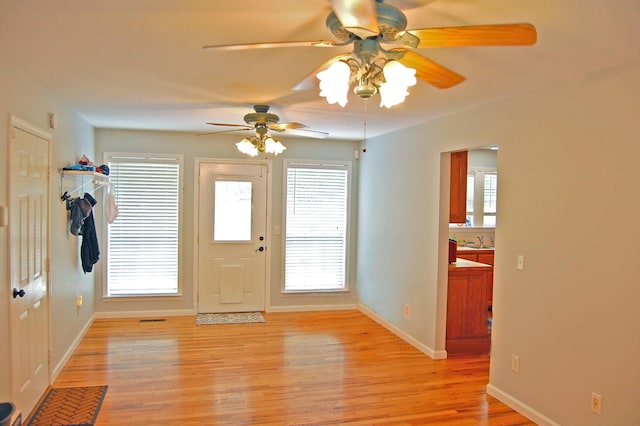 547 Grindstone Hollow Rd, Dickson, TN 37055 - foyer with light wood-style floors, ceiling fan, and baseboards