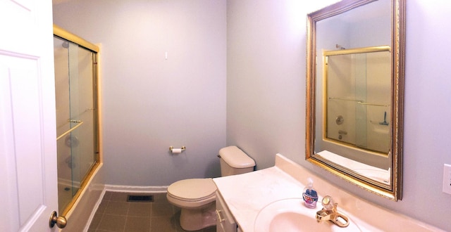 547 Grindstone Hollow Rd, Dickson, TN 37055 - bathroom with tile patterned flooring, toilet, vanity, enclosed tub / shower combo, and baseboards