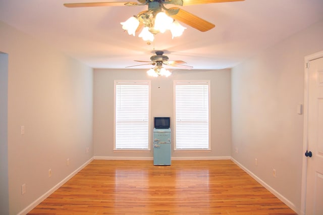 547 Grindstone Hollow Rd, Dickson, TN 37055 - unfurnished room with a ceiling fan, light wood finished floors, and baseboards