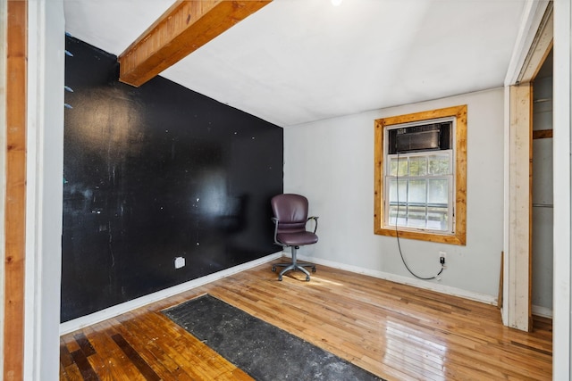 sitting room featuring hardwood / wood-style floors and baseboards