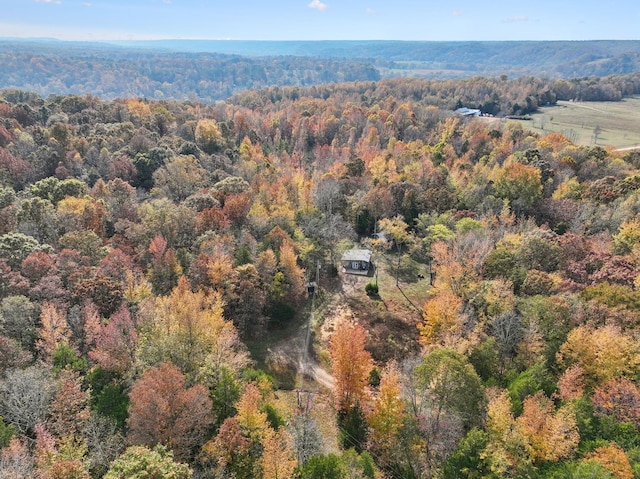 birds eye view of property with a wooded view