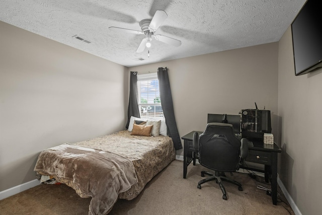 bedroom featuring visible vents, a ceiling fan, and light carpet