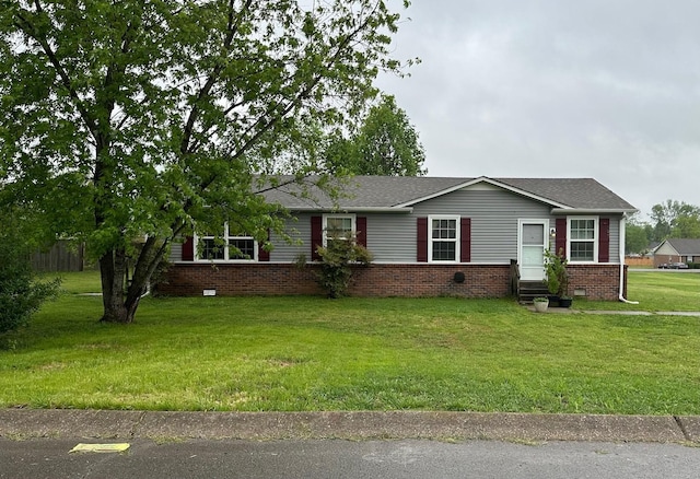 ranch-style house with brick siding and a front lawn