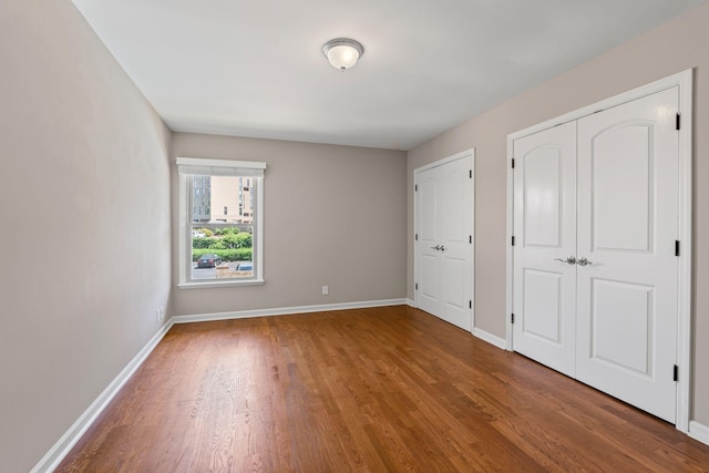 3901 Whitland Ave Unit 20, Nashville, TN 37205 - unfurnished bedroom with baseboards, wood finished floors, and a closet