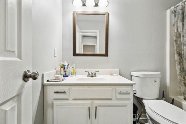 full bathroom featuring vanity and toilet