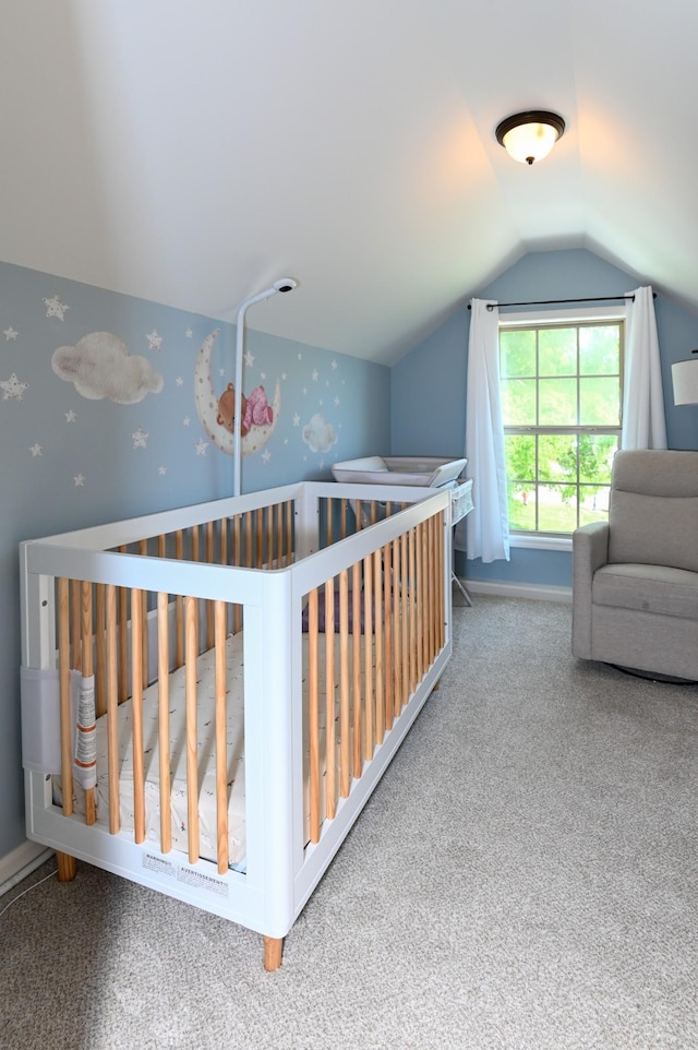 carpeted bedroom featuring lofted ceiling