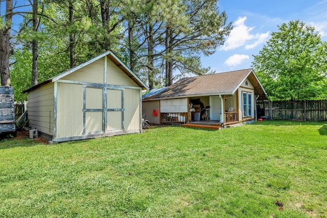view of shed with fence