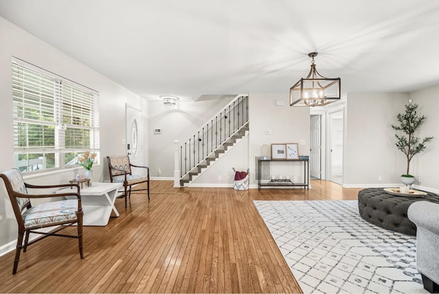 174 Hickory Ln, Jacksboro, TN 37757 - living area with hardwood / wood-style flooring, stairway, a chandelier, and baseboards