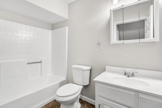 174 Hickory Ln, Jacksboro, TN 37757 - full bath with baseboards, toilet, shower / bathtub combination, and vanity