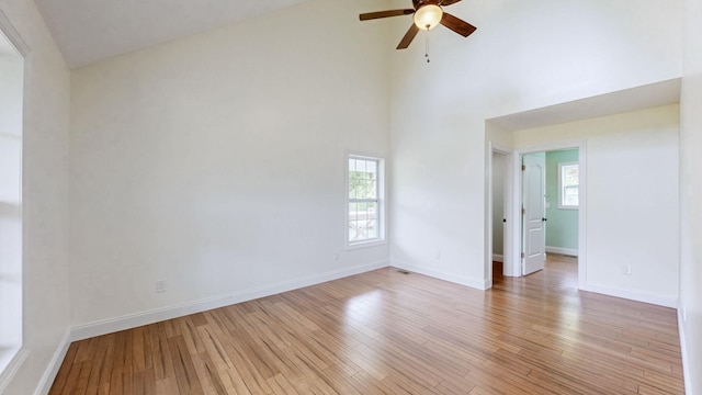 1344 French Brantley Rd, Wartrace, TN 37183 - unfurnished room featuring ceiling fan, light wood finished floors, a towering ceiling, and baseboards