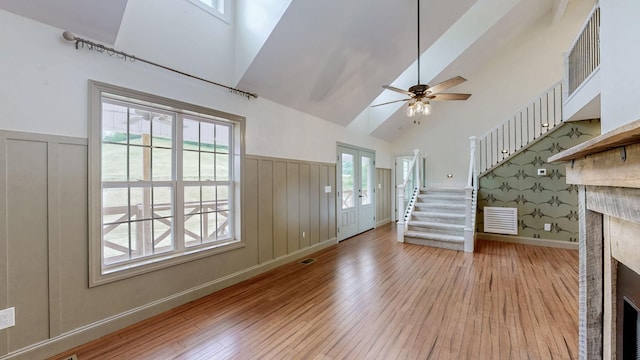 1344 French Brantley Rd, Wartrace, TN 37183 - entryway with a fireplace, hardwood / wood-style floors, stairway, high vaulted ceiling, and wainscoting