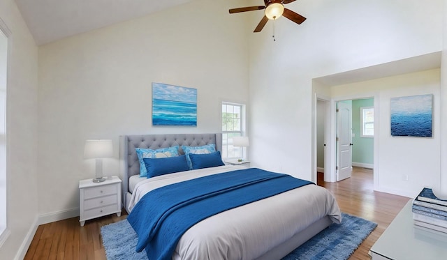 1344 French Brantley Rd, Wartrace, TN 37183 - bedroom featuring wood finished floors, baseboards, a towering ceiling, and ceiling fan