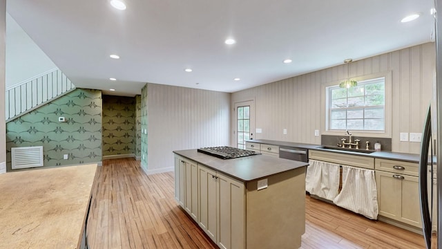 1344 French Brantley Rd, Wartrace, TN 37183 - kitchen with a sink, wallpapered walls, appliances with stainless steel finishes, light wood finished floors, and a center island