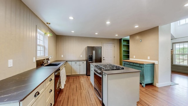 1344 French Brantley Rd, Wartrace, TN 37183 - kitchen with appliances with stainless steel finishes, a sink, light wood-style flooring, a center island, and recessed lighting