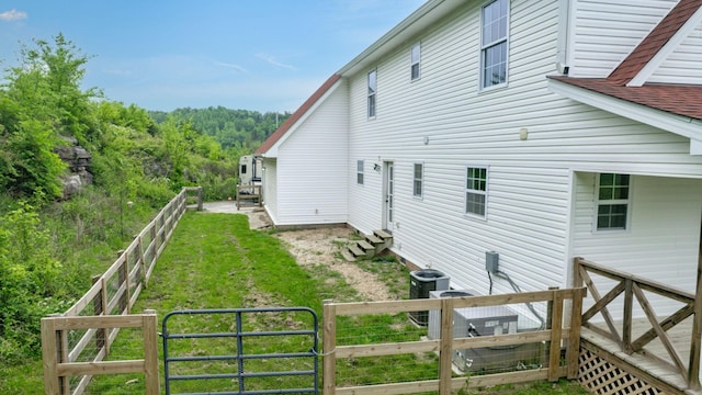 1344 French Brantley Rd, Wartrace, TN 37183 - view of property exterior with entry steps, central AC unit, and a forest view