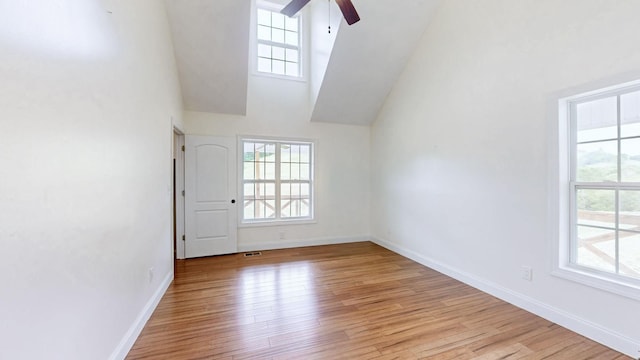1344 French Brantley Rd, Wartrace, TN 37183 - unfurnished room featuring ceiling fan, light wood-style floors, baseboards, and high vaulted ceiling