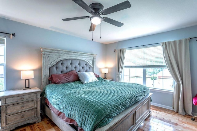 8424 Shadetree Ln, Ooltewah, TN 37363 - bedroom with light wood-style flooring, baseboards, and ceiling fan
