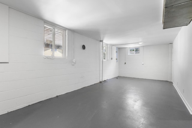 below grade area featuring plenty of natural light and concrete block wall
