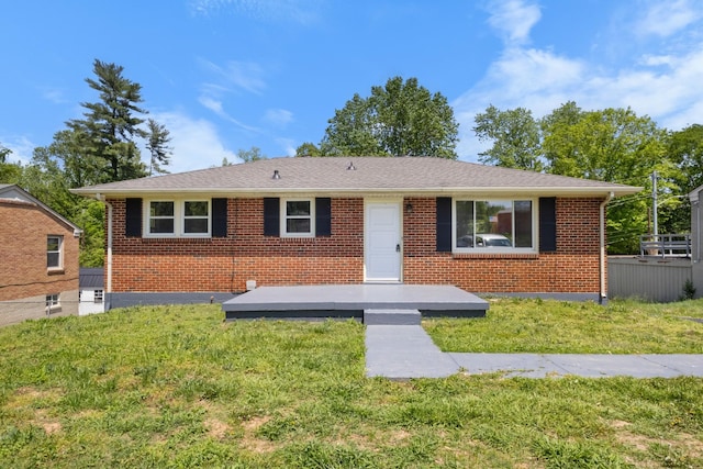 ranch-style home with brick siding and a front lawn