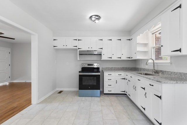 kitchen with under cabinet range hood, white cabinetry, a sink, and stainless steel range with electric stovetop