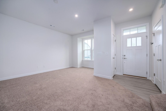 foyer entrance featuring a wealth of natural light, recessed lighting, and baseboards