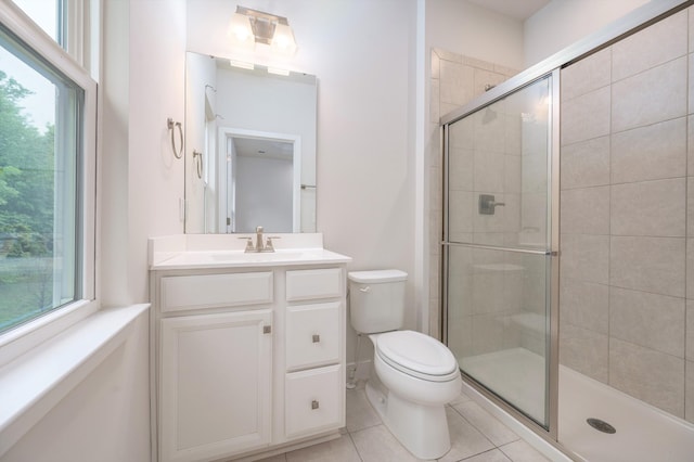 full bathroom with toilet, a stall shower, tile patterned floors, and a healthy amount of sunlight