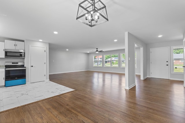 466 Lafayette Rd, Clarksville, TN 37042 - unfurnished living room featuring baseboards, recessed lighting, and wood finished floors