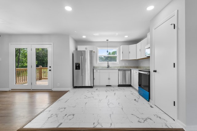466 Lafayette Rd, Clarksville, TN 37042 - kitchen featuring a sink, baseboards, light countertops, stainless steel appliances, and recessed lighting