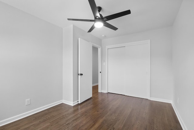 466 Lafayette Rd, Clarksville, TN 37042 - unfurnished bedroom with baseboards, ceiling fan, a closet, and dark wood-type flooring