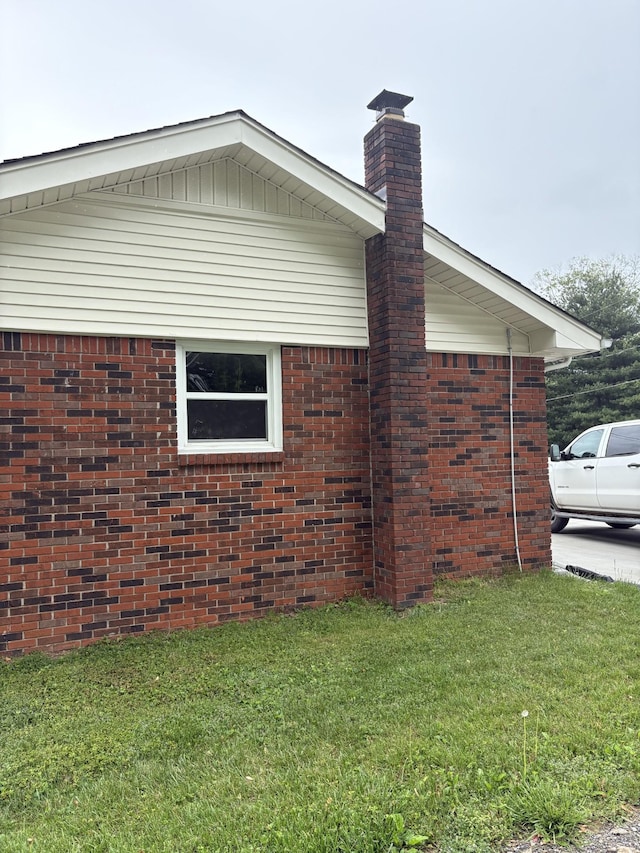 1400 Dogwood Ln, Lafayette, TN 37083 - view of side of home with brick siding, a chimney, and a lawn