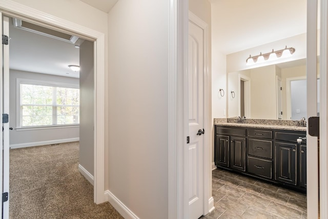 1041 Irish Way, Spring Hill, TN 37174 - full bathroom with double vanity, baseboards, and a sink