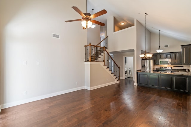 1041 Irish Way, Spring Hill, TN 37174 - unfurnished living room with a sink, high vaulted ceiling, visible vents, washer and dryer, and ceiling fan with notable chandelier