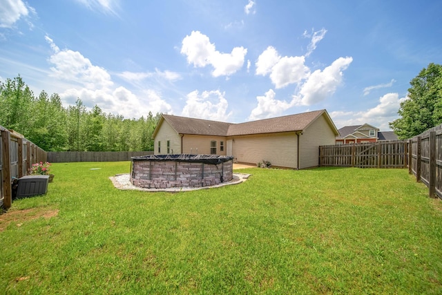 view of yard with a fenced backyard and a fenced in pool