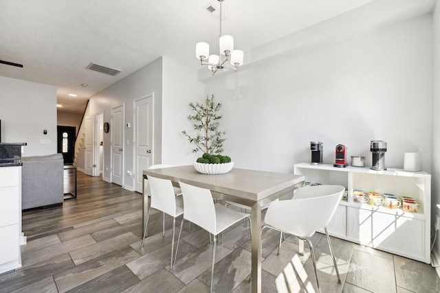 605 Longfellow Ln, Smyrna, TN 37167 - dining room featuring visible vents, wood finished floors, and a chandelier
