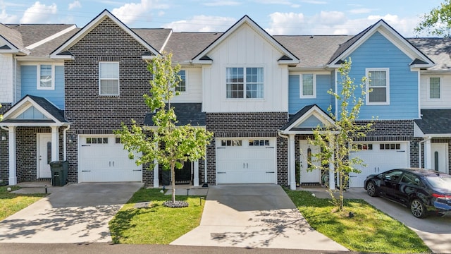 605 Longfellow Ln, Smyrna, TN 37167 - multi unit property featuring concrete driveway, an attached garage, board and batten siding, and brick siding