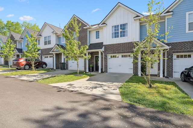 605 Longfellow Ln, Smyrna, TN 37167 - multi unit property featuring a residential view, driveway, board and batten siding, brick siding, and an attached garage