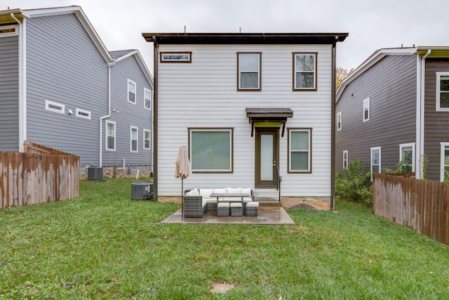 back of property featuring a lawn, fence, a patio area, and an outdoor living space