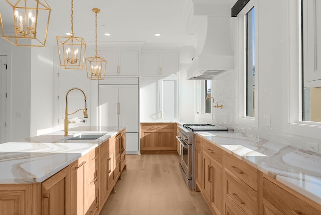 95 Leonard Ave Unit 1, Nashville, TN 37205 - kitchen featuring high end range, custom range hood, light wood finished floors, a chandelier, and a sink