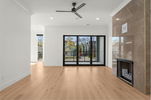 95 Leonard Ave Unit 1, Nashville, TN 37205 - unfurnished living room with ornamental molding, a fireplace, light wood-style floors, baseboards, and ceiling fan