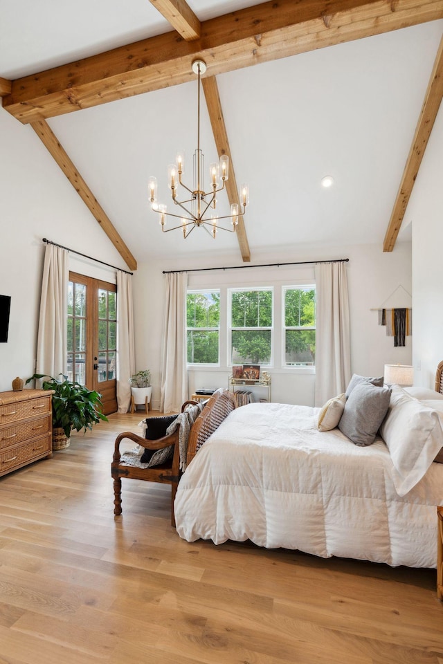 bedroom with beam ceiling, wood finished floors, access to outside, a chandelier, and french doors