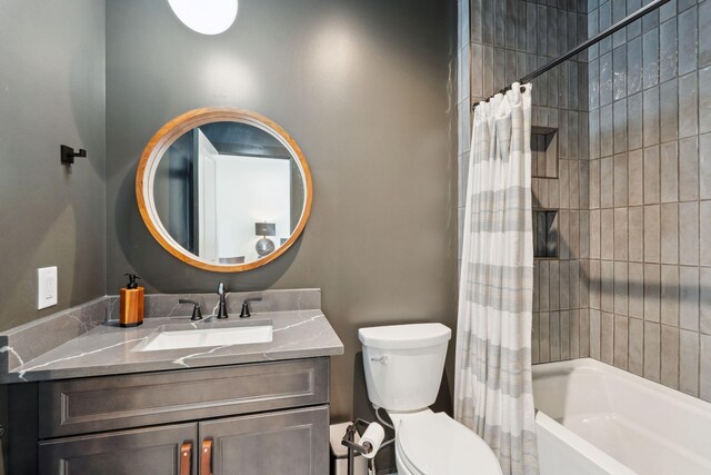 full bath with vanity, toilet, and shower / tub combo with curtain