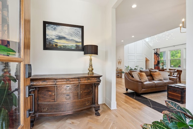 living area featuring recessed lighting and baseboards