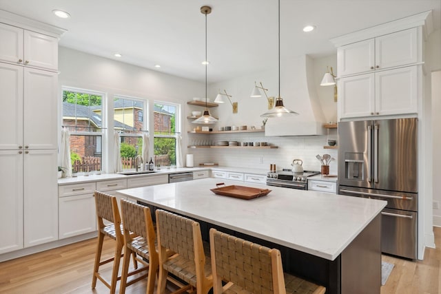 kitchen featuring open shelves, light wood finished floors, white cabinetry, and stainless steel appliances