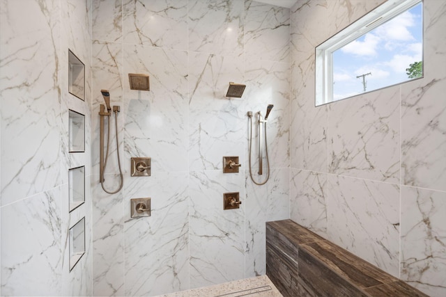 bathroom with a tile shower