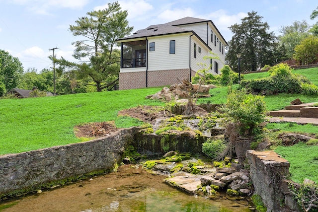 view of yard featuring a sunroom