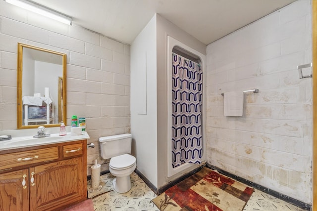 bathroom featuring toilet and vanity