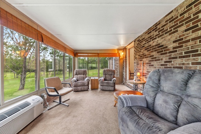 sunroom / solarium with an outdoor hangout area and a wall mounted AC