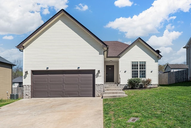 1277 Morstead Dr, Clarksville, TN 37042 - view of front facade with fence, cooling unit, a garage, driveway, and a front lawn