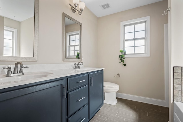 1277 Morstead Dr, Clarksville, TN 37042 - full bathroom featuring a healthy amount of sunlight, baseboards, and a sink